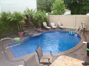 brick-paver-patio-in-ground-pool-and-outdoor-kitchen-23